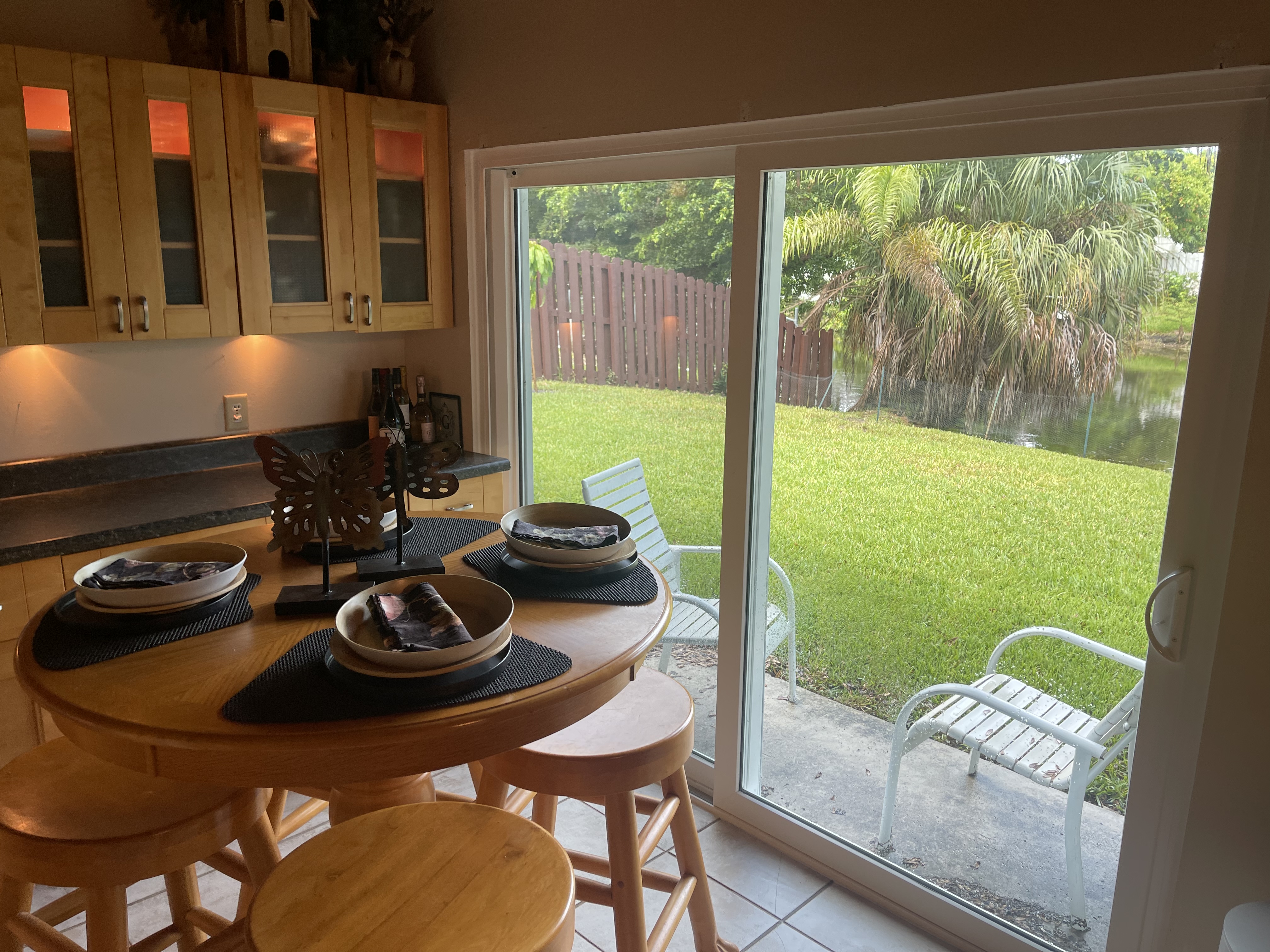 Breakfast area overlooking the backyard and water